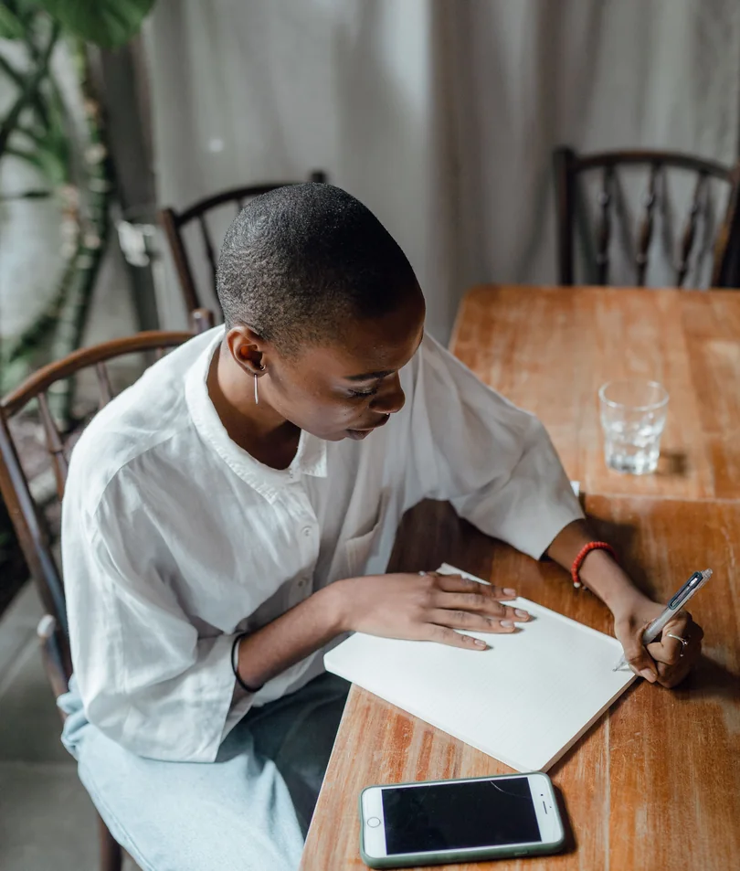 A young writer working through a draft by hand